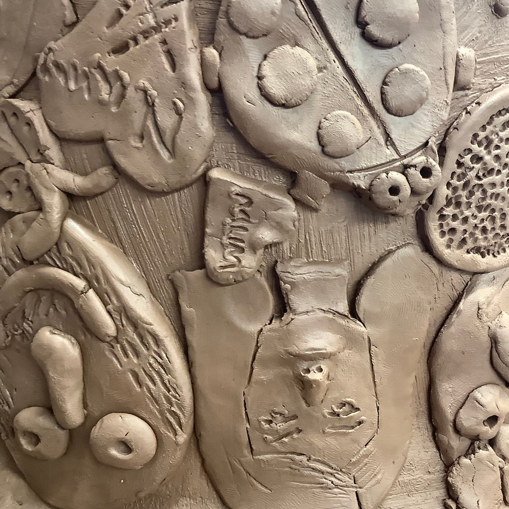 close up of 70th birthday terracotta pot made by family at eastnor pottery