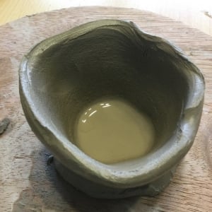wet pot made on potter's wheel by a very young child at worcester museum