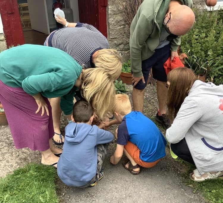family inspecting their pottery they made at eastnor pottery