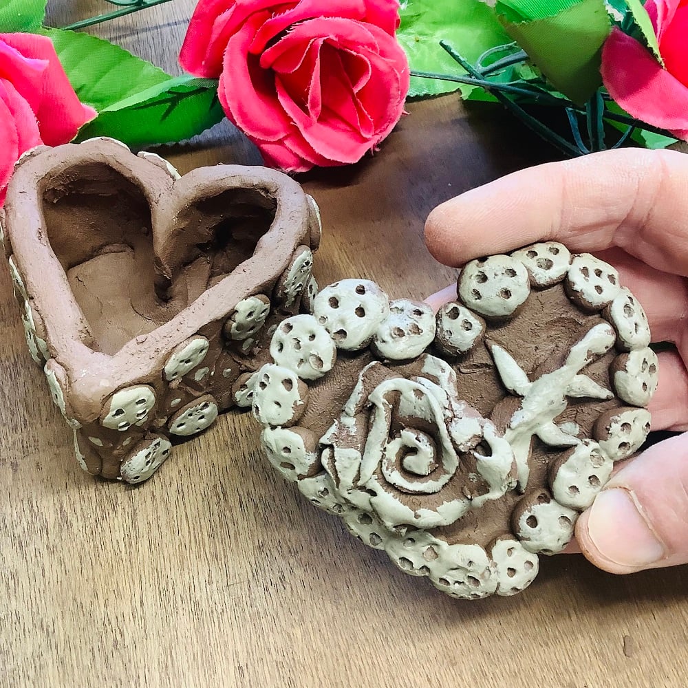valentines day inspired pottery lidded pot project in the shape of a heart for families in feb half term at eastnor pottery