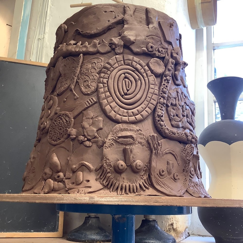 upside down terracotta pot made by three generations of the same family to celebrate a 70th birthday