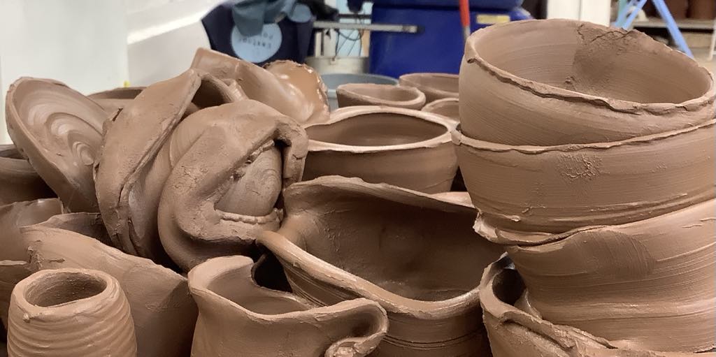 A pile of squashed clay pots to be recycled.