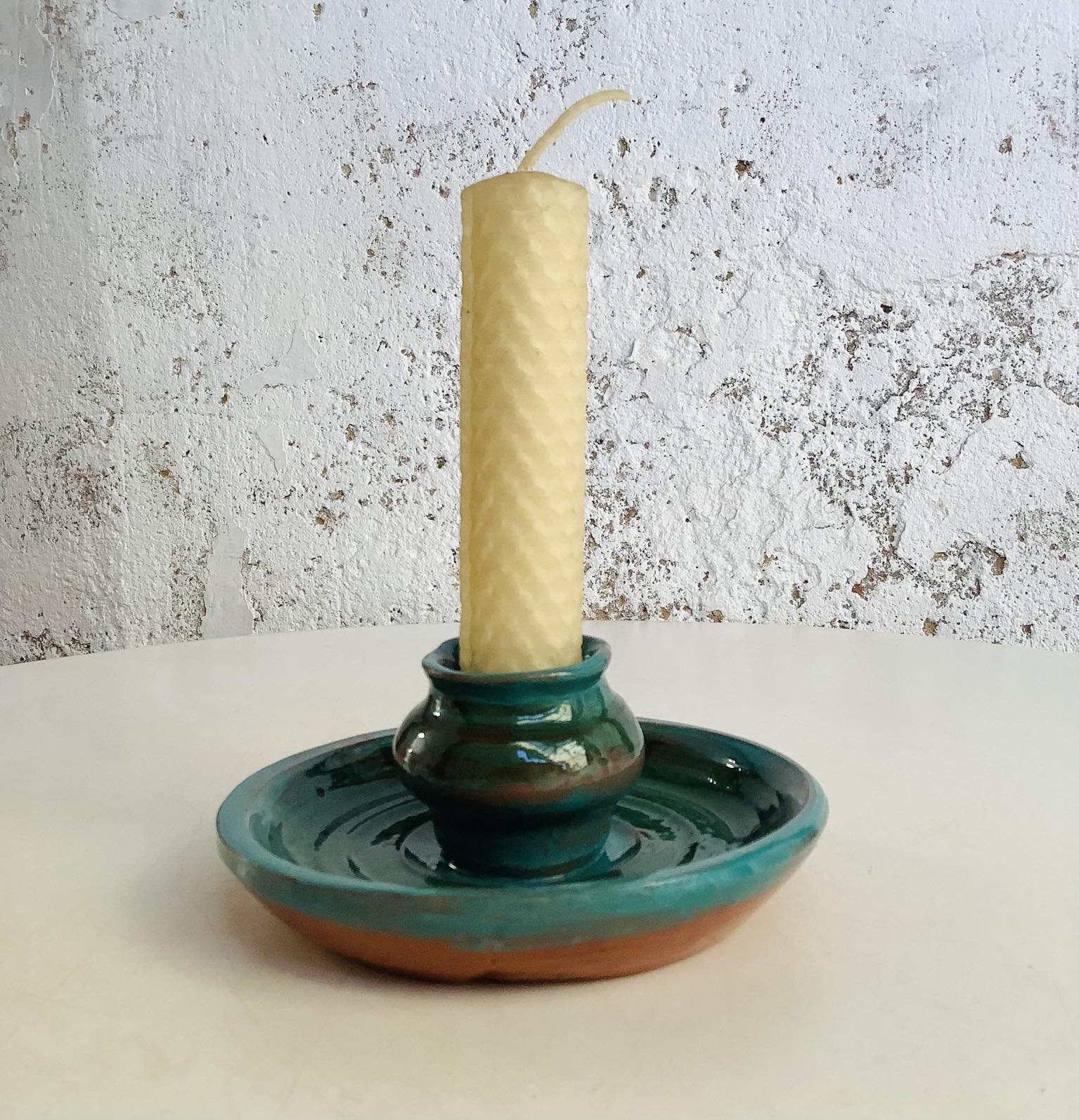 Green painted pottery candle holder with bees wax candle