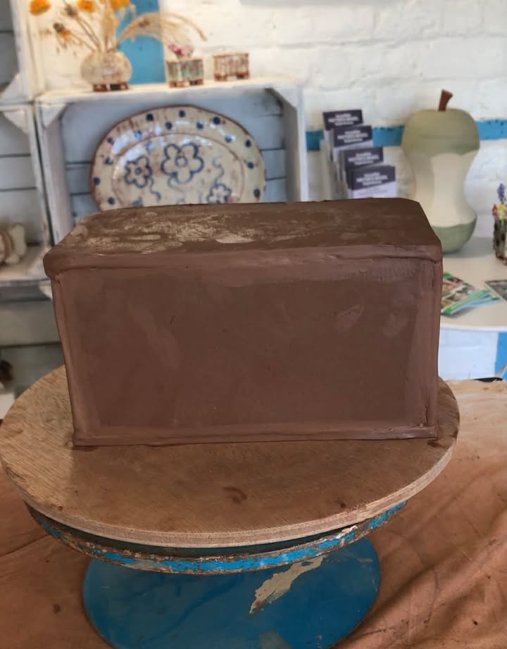 A wet terracotta clay rectanglar box.